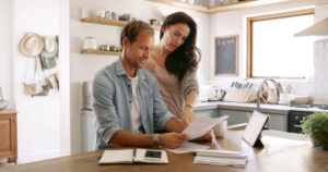 Couple reviewing tax bills and planning