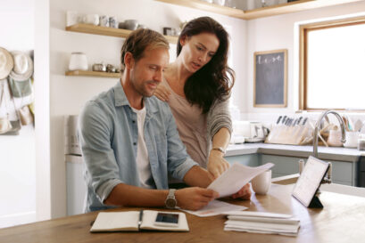 Couple reviewing tax bills and planning